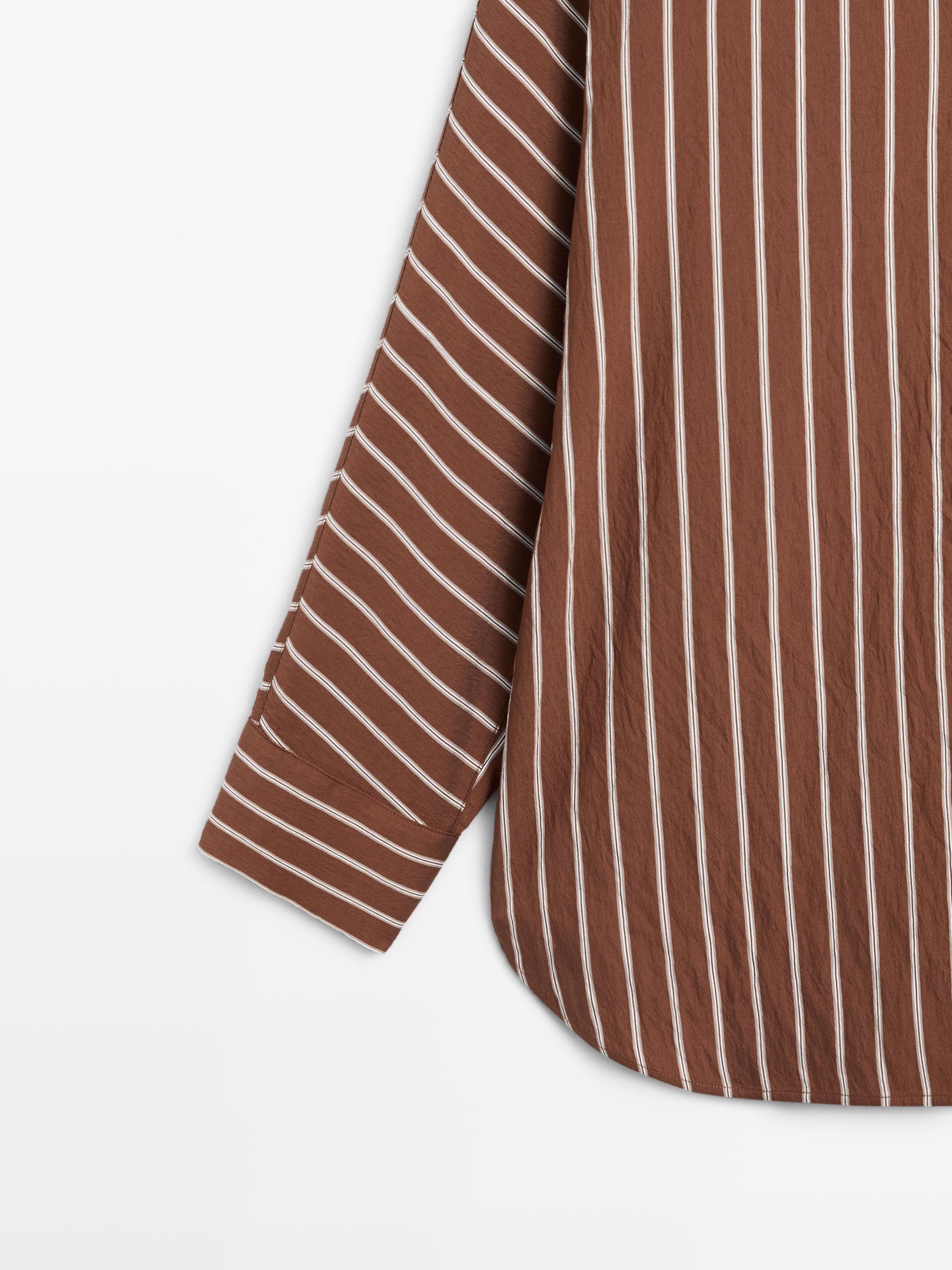 Flowing striped shirt with batwing sleeves